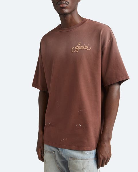 Man wearing a designer T-shirt.