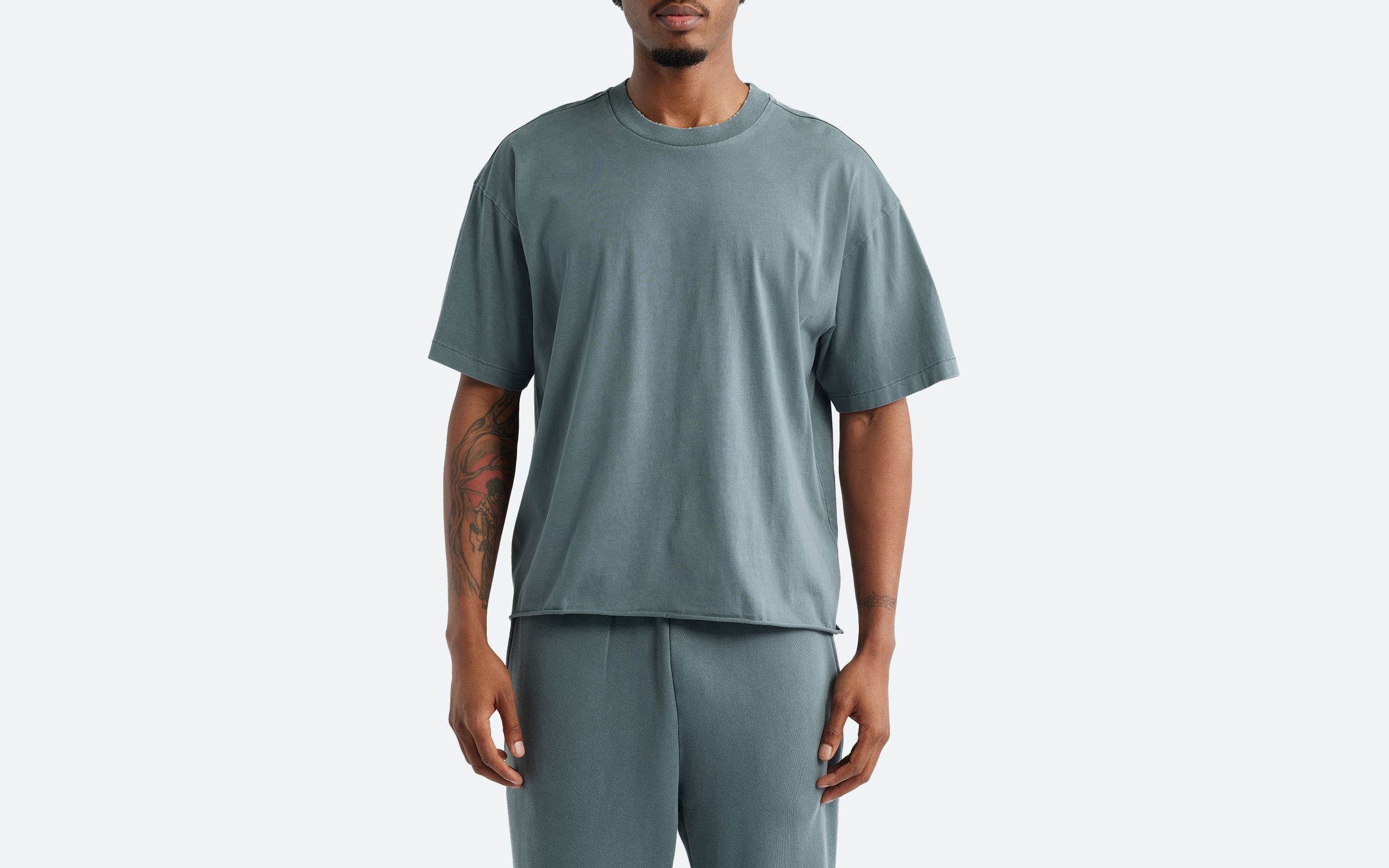 Man wearing a short-sleeve T-shirt.