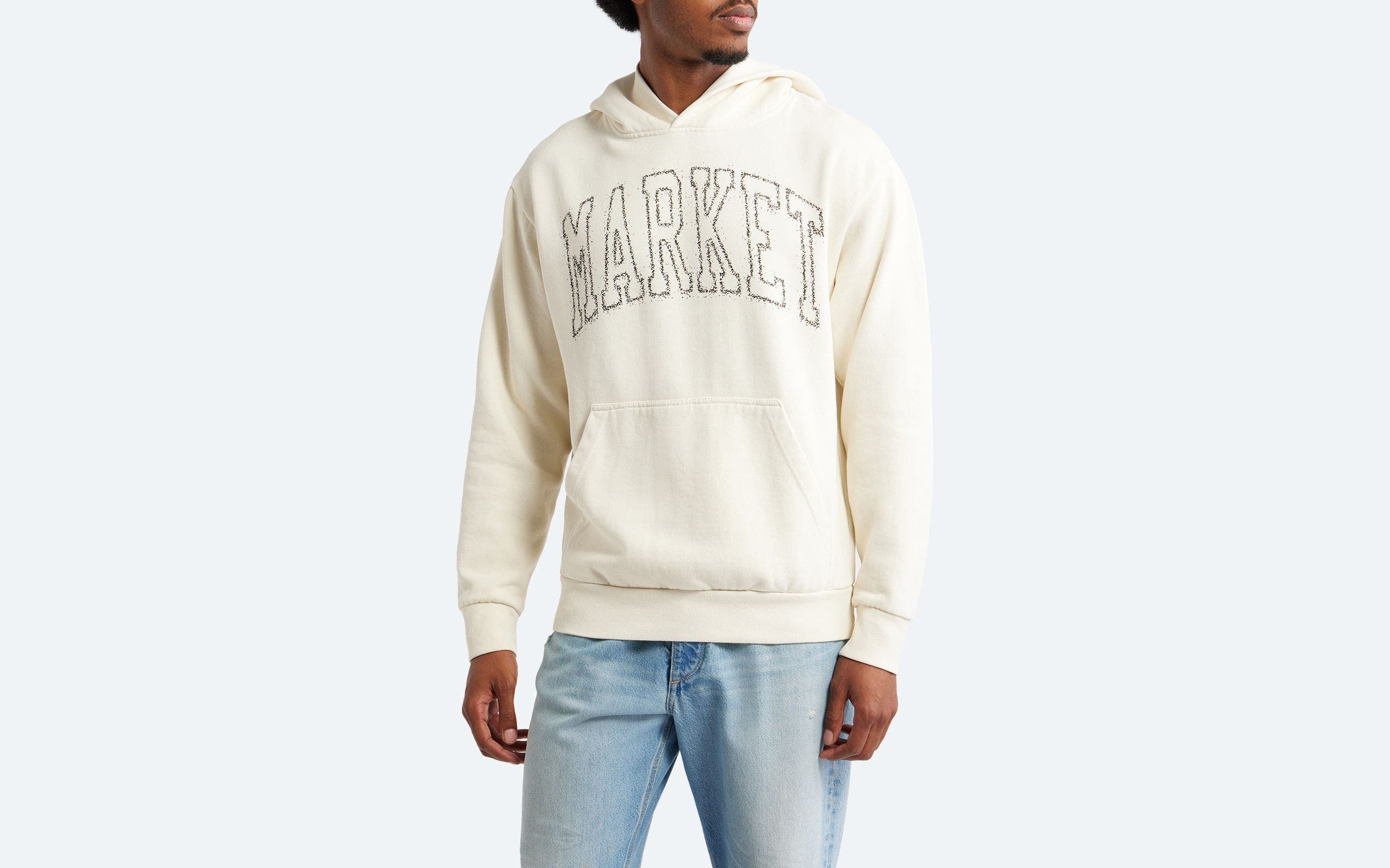 Man wearing a logo hoodie.