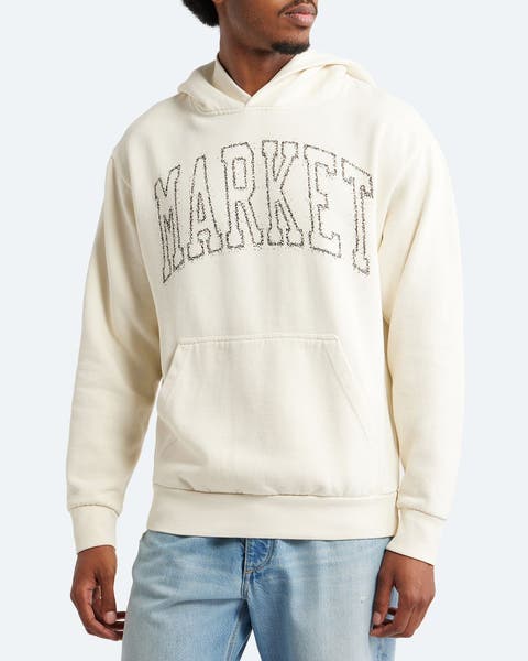 Man wearing a logo hoodie.