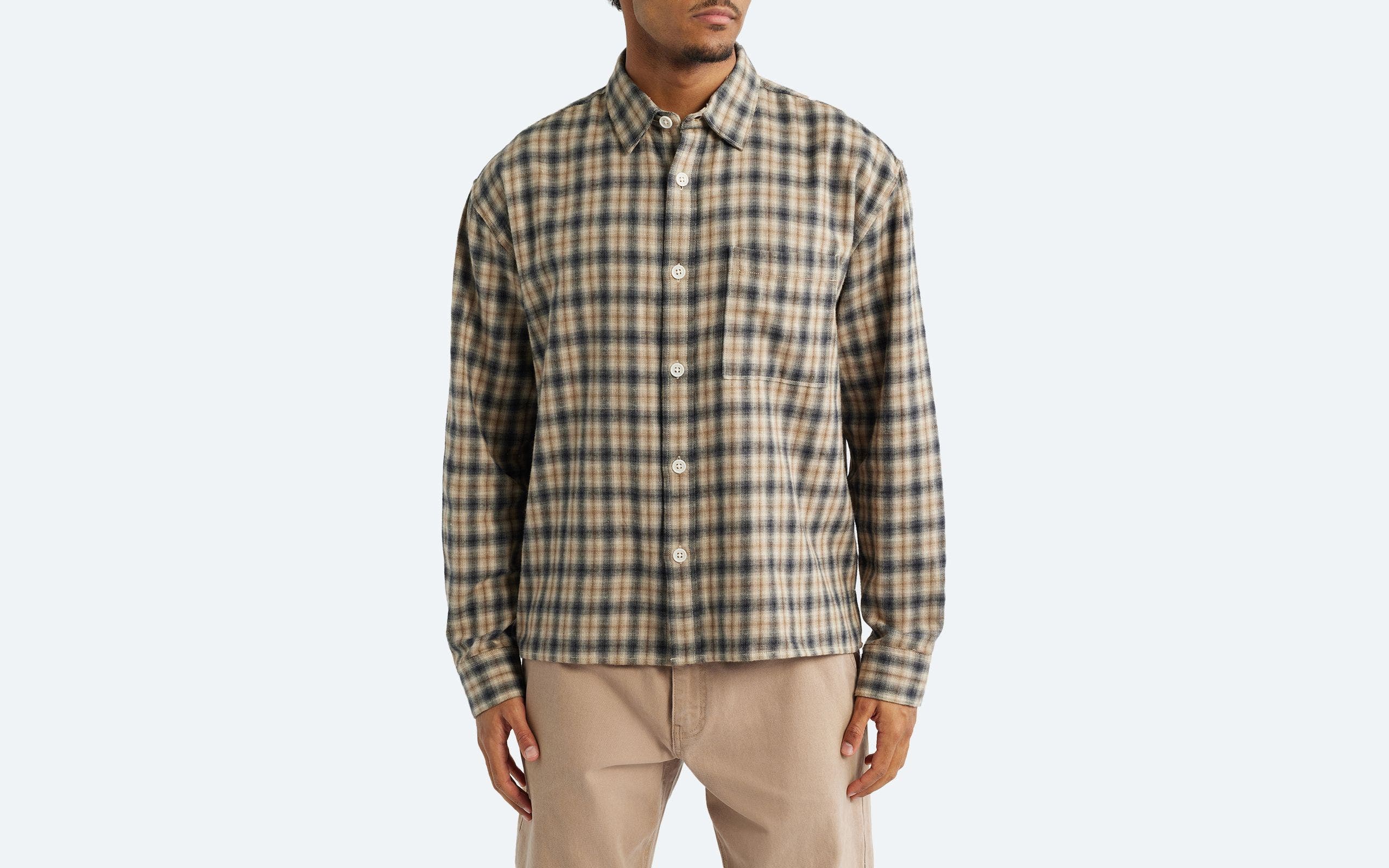 Man wearing a casual button-up shirt.