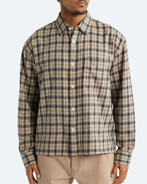 Man wearing a casual button-up shirt.