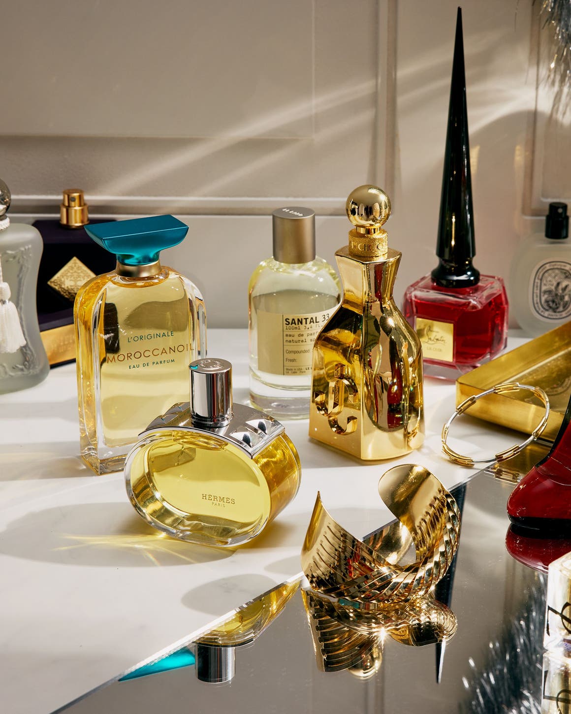 An assortment of perfume bottles on a countertop.
