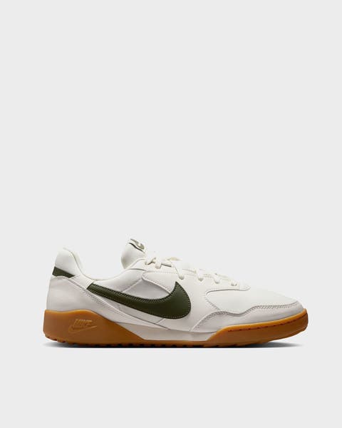 A white Nike sneaker. 