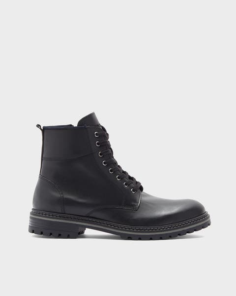 A black combat boot.