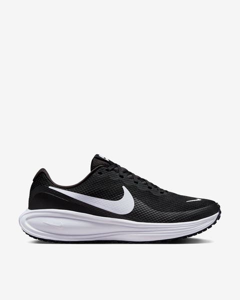 A woman’s black Nike sneaker.