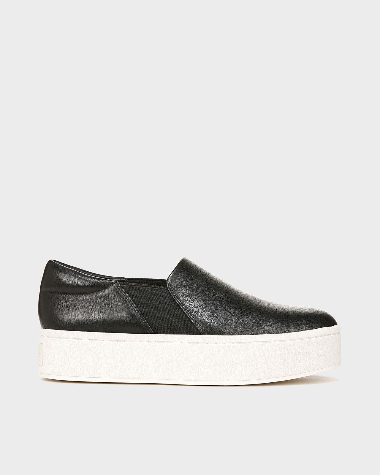 A black platform slip-on sneaker.