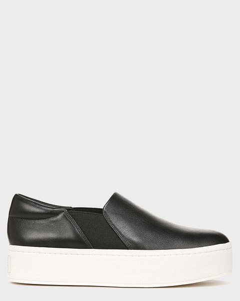 A black platform slip-on sneaker.