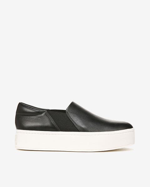 A black platform slip-on sneaker.