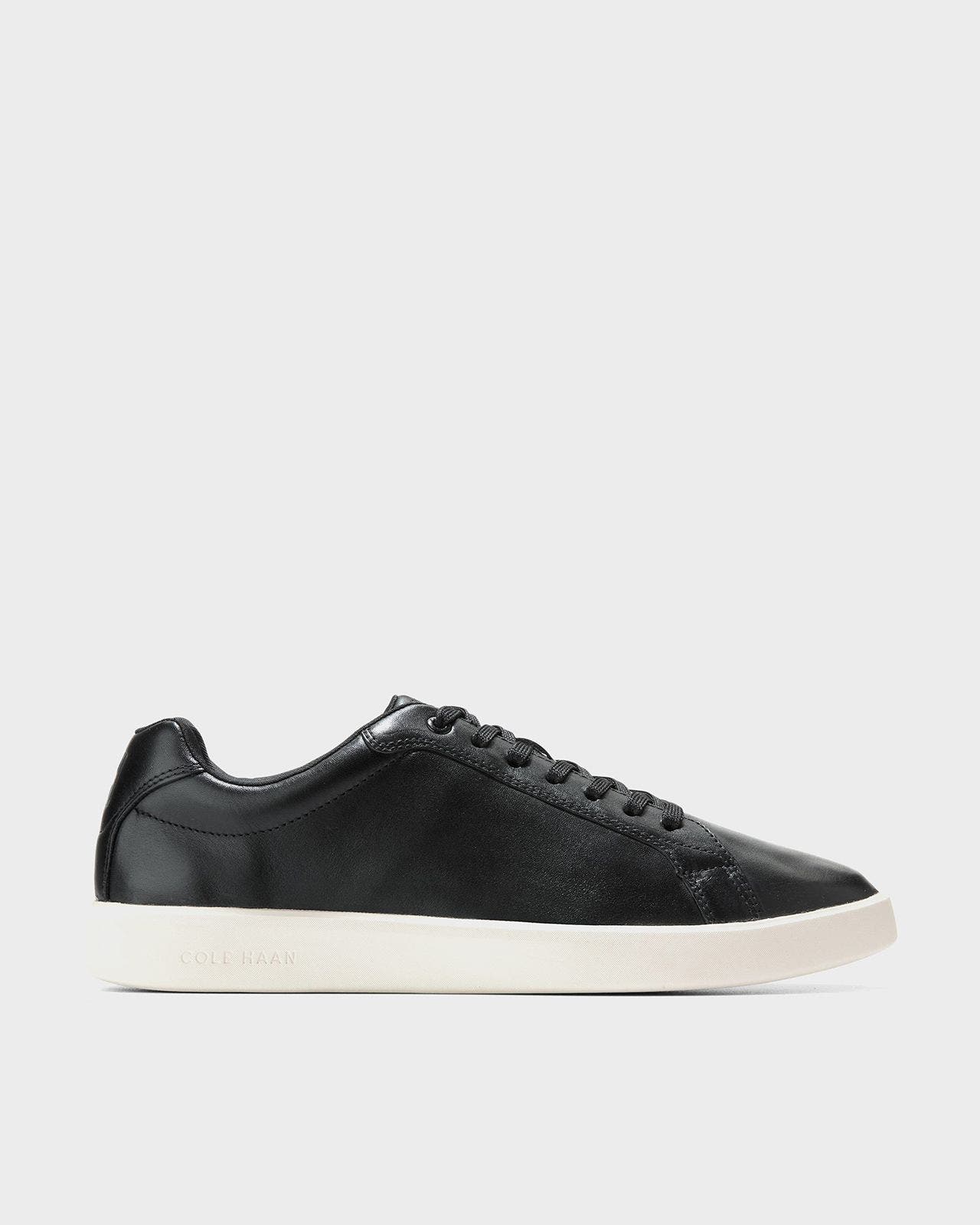 A men’s black sneaker. 