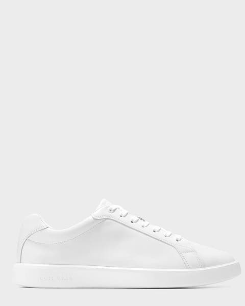 A white Cole Haan sneaker.