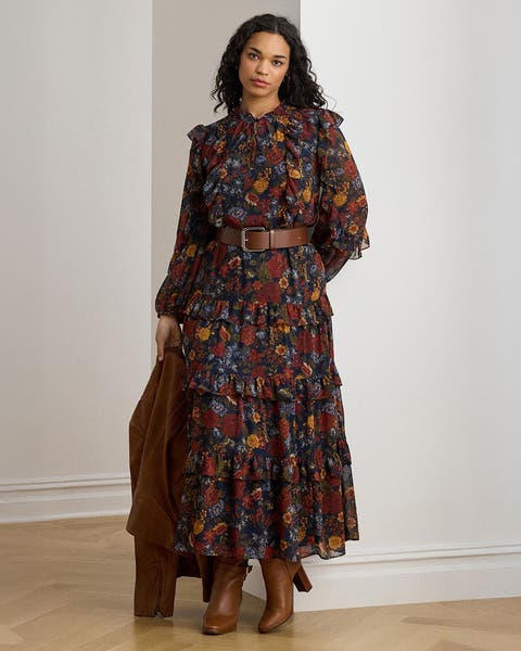 A woman wearing a floral-print tiered dress.