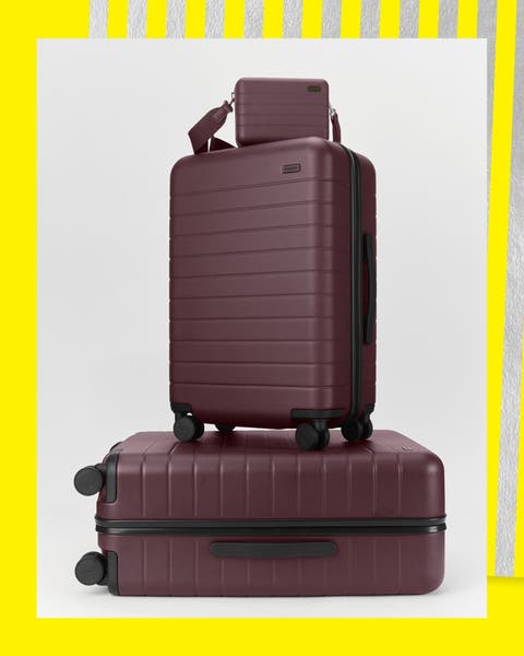 Wheeled suitcases and a matching handbag.