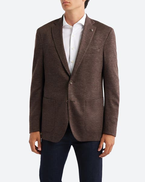 A man wearing a classic-fit sport coat.