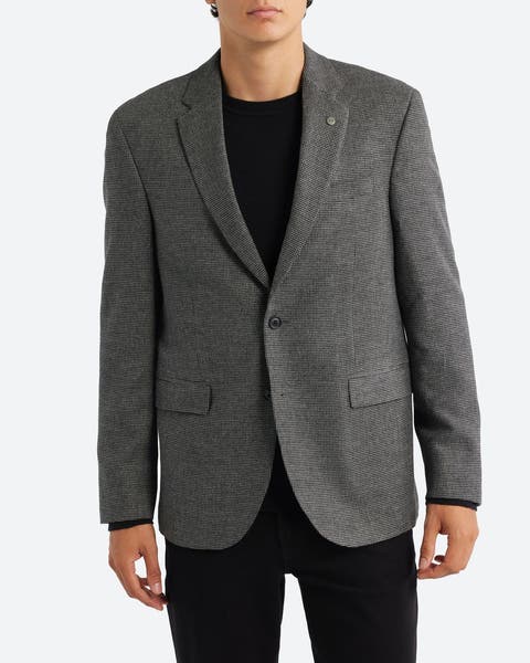 A man wearing a slim-fit blazer.