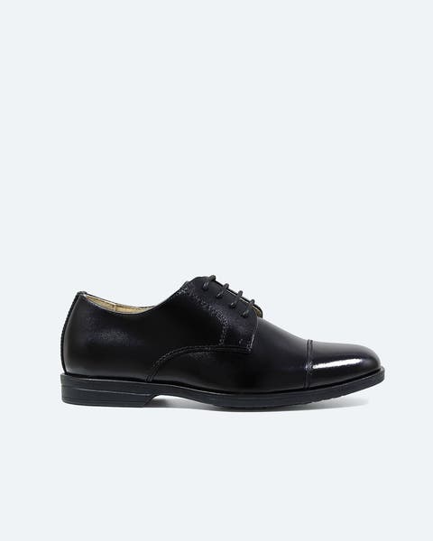 Black leather oxford dress shoe.