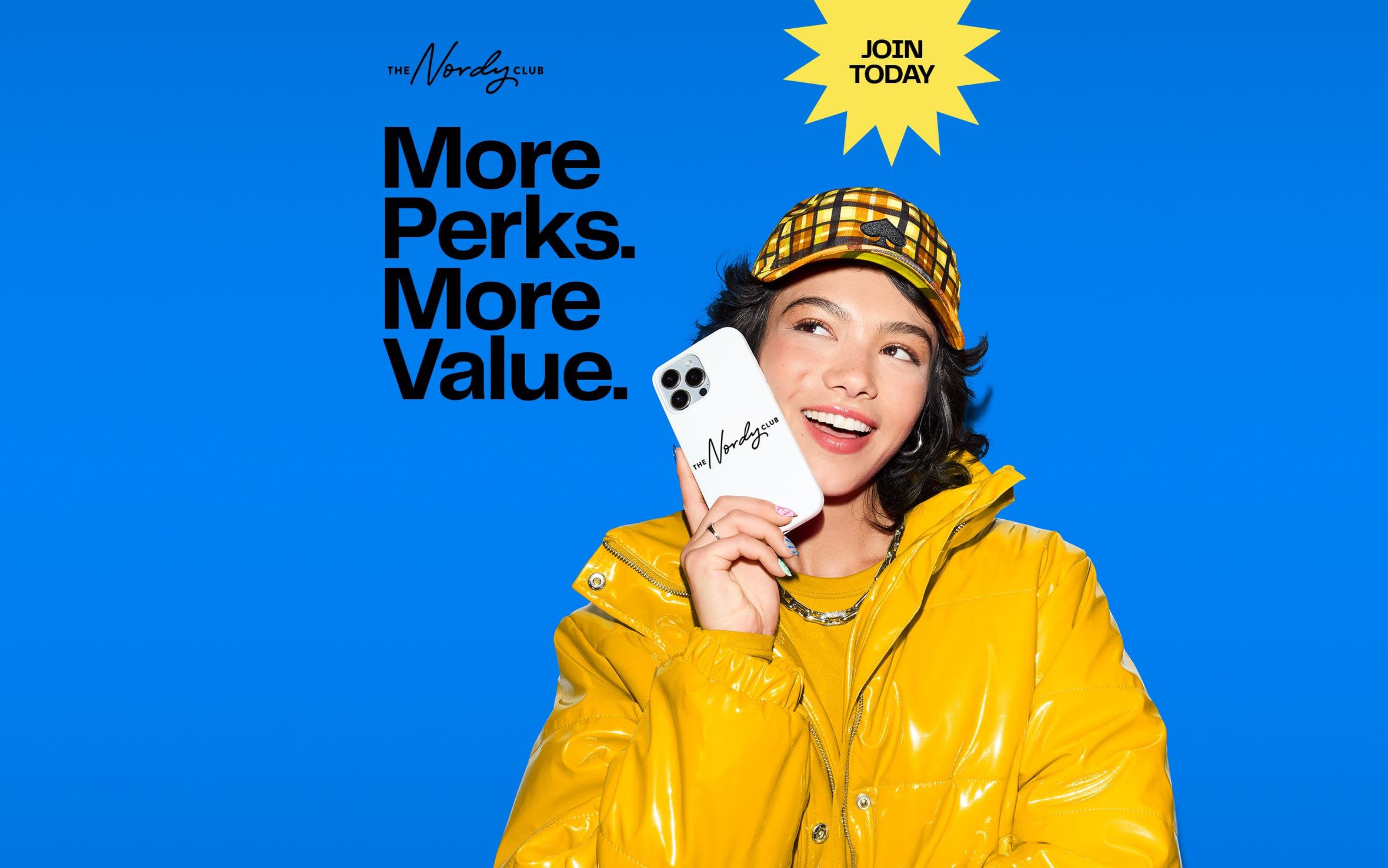 Join today: more perks, more value. A woman wearing a yellow jacket.