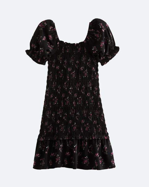 Black floral print dress with short puffed sleeves.