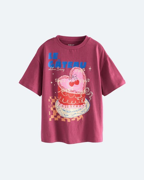 Graphic tee printed with a heart-shaped cake.