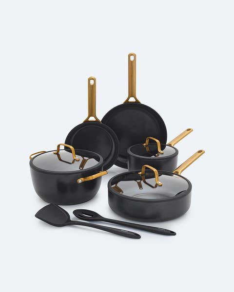 GreenPan set of pots and pans with lids and cooking utensils.