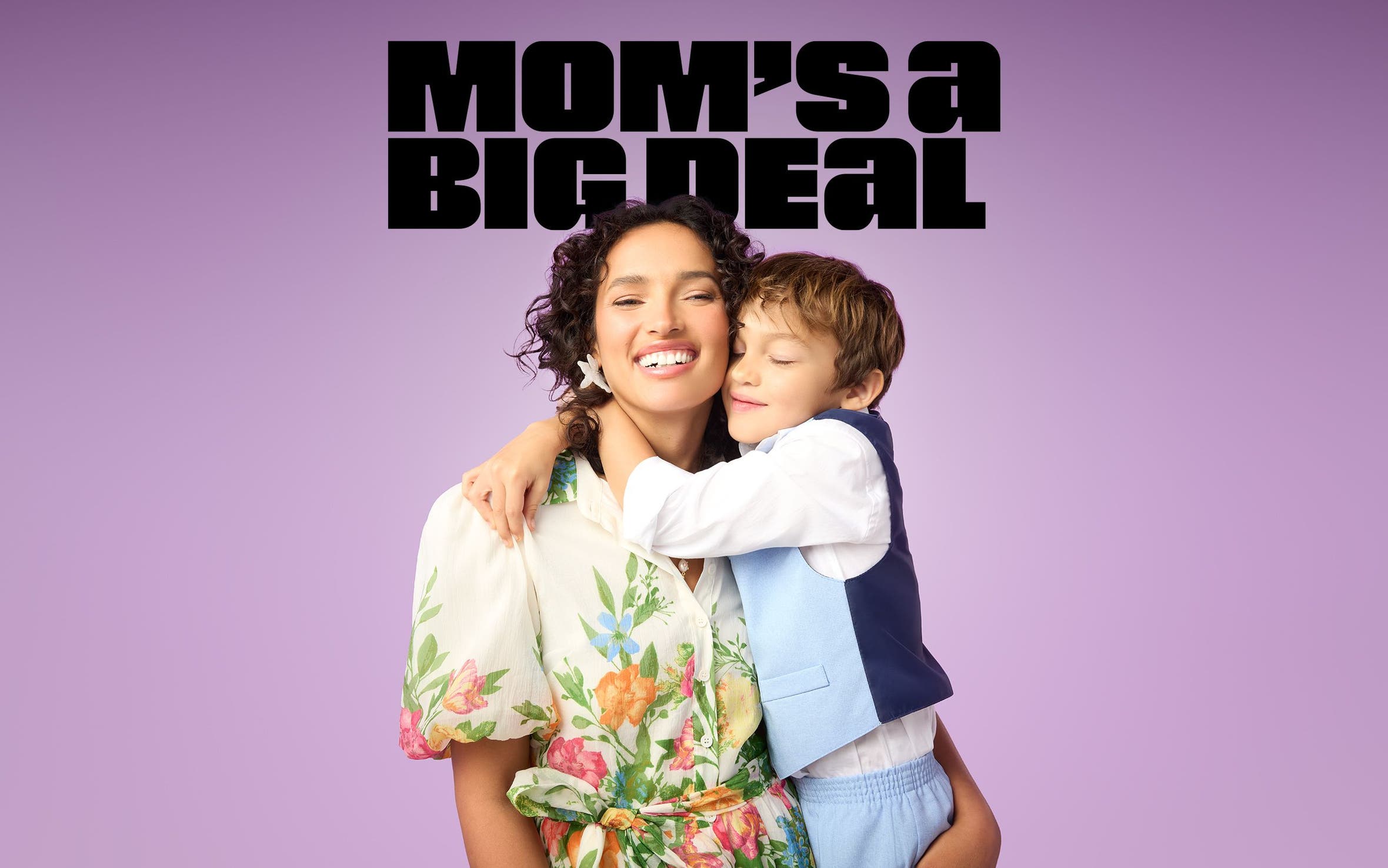 Mom’s a big deal. A woman and young boy hug.