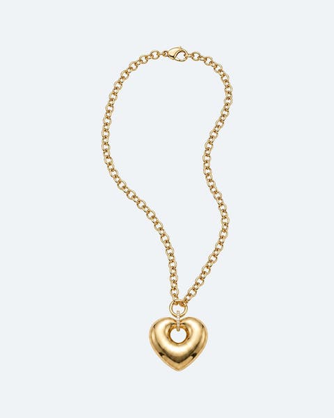 Gold heart pendant on a chain-link necklace.