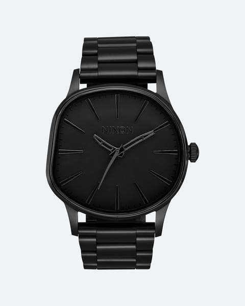 Matte black Nixon watch with irregular-shaped bezel.