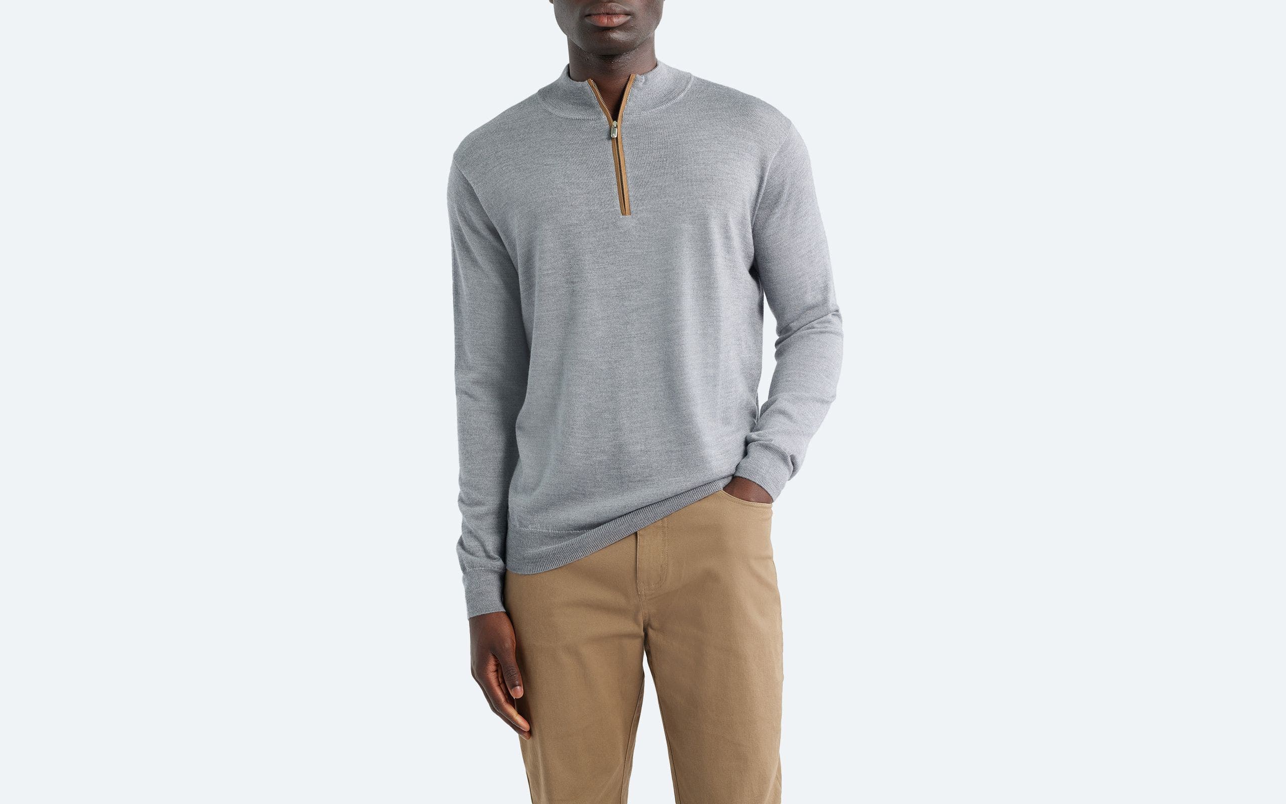A man wearing a quarter-zip sweater.