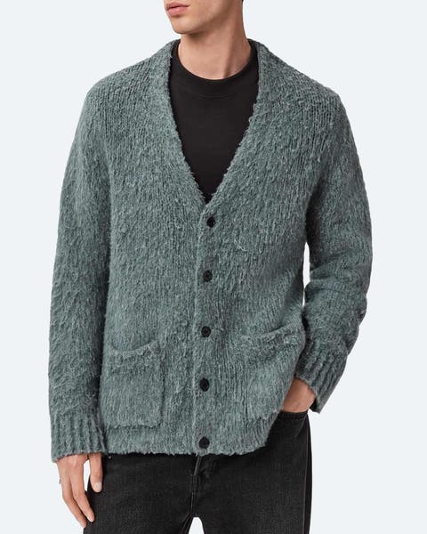 A man wearing a cardigan sweater.
