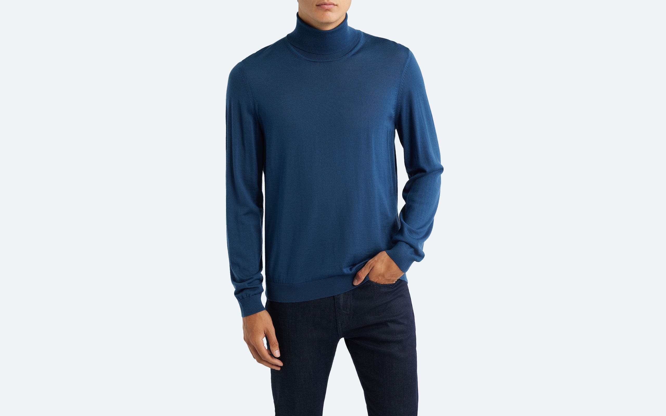 A man wearing a turtleneck sweater.