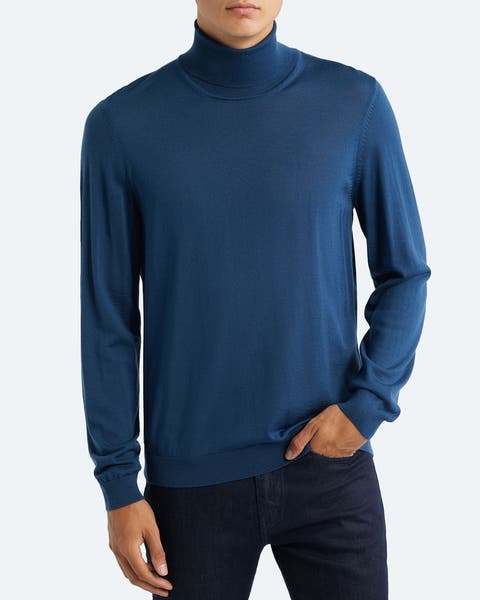 A man wearing a turtleneck sweater.