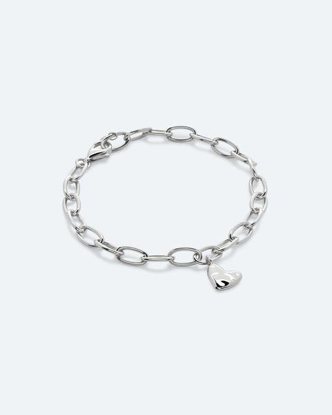 A silver chain bracelet with a heart charm.