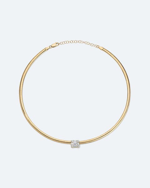 A gold choker necklace with a diamond pendant.