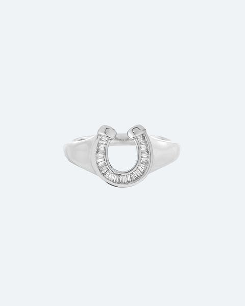 A silver and diamond ring shaped like a horseshoe.