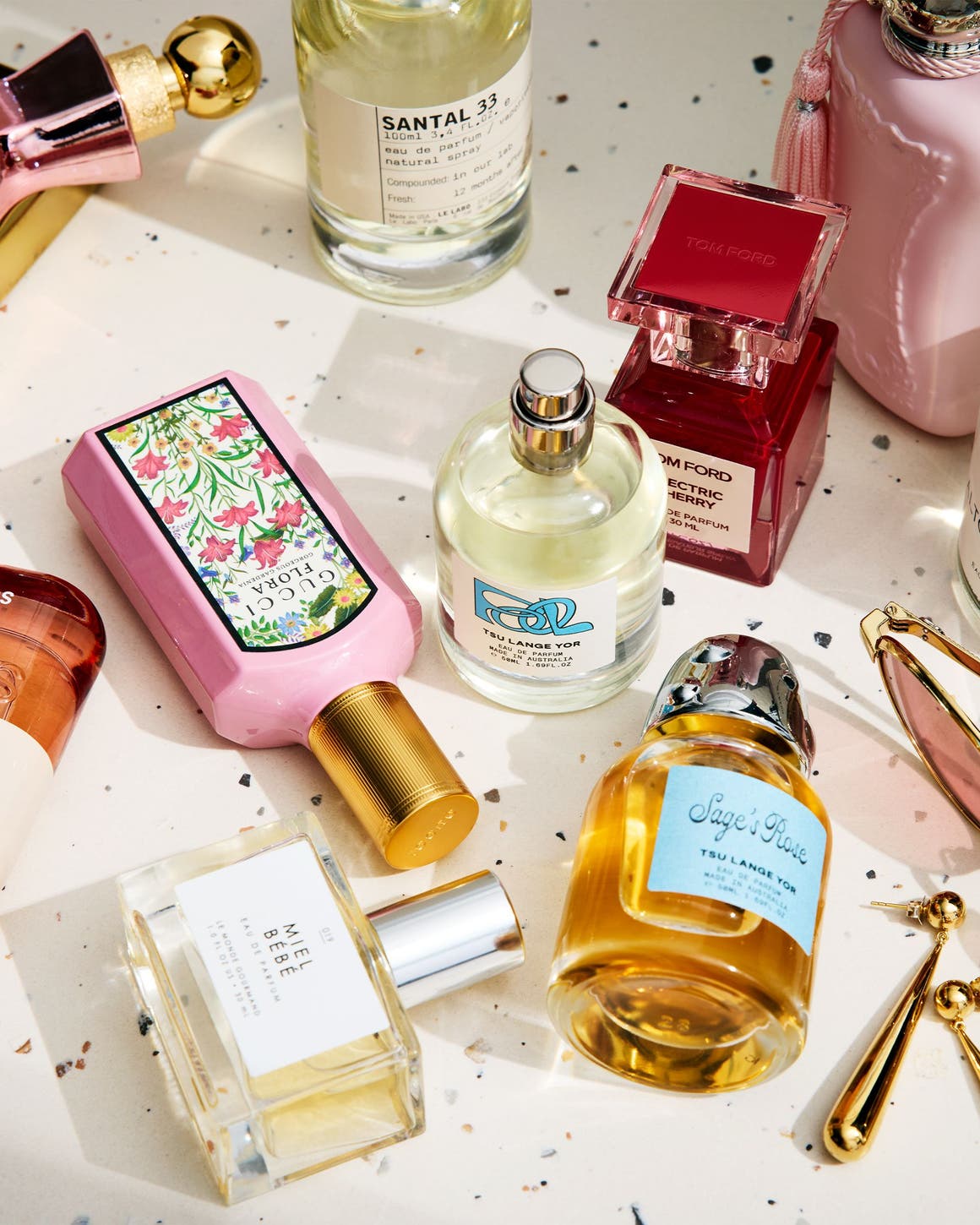 An assortment of perfume bottles on a countertop.