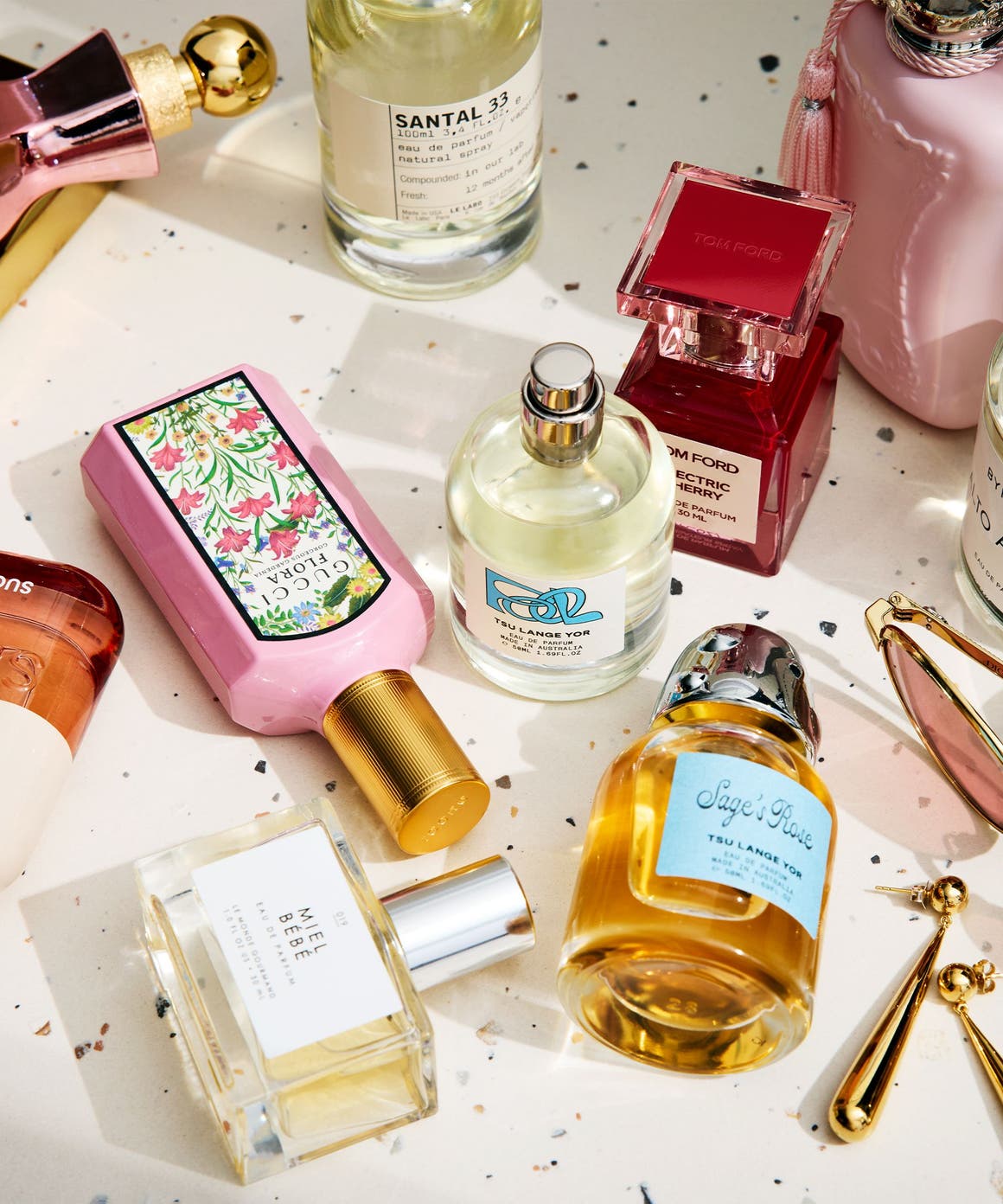 An assortment of perfume bottles on a countertop.