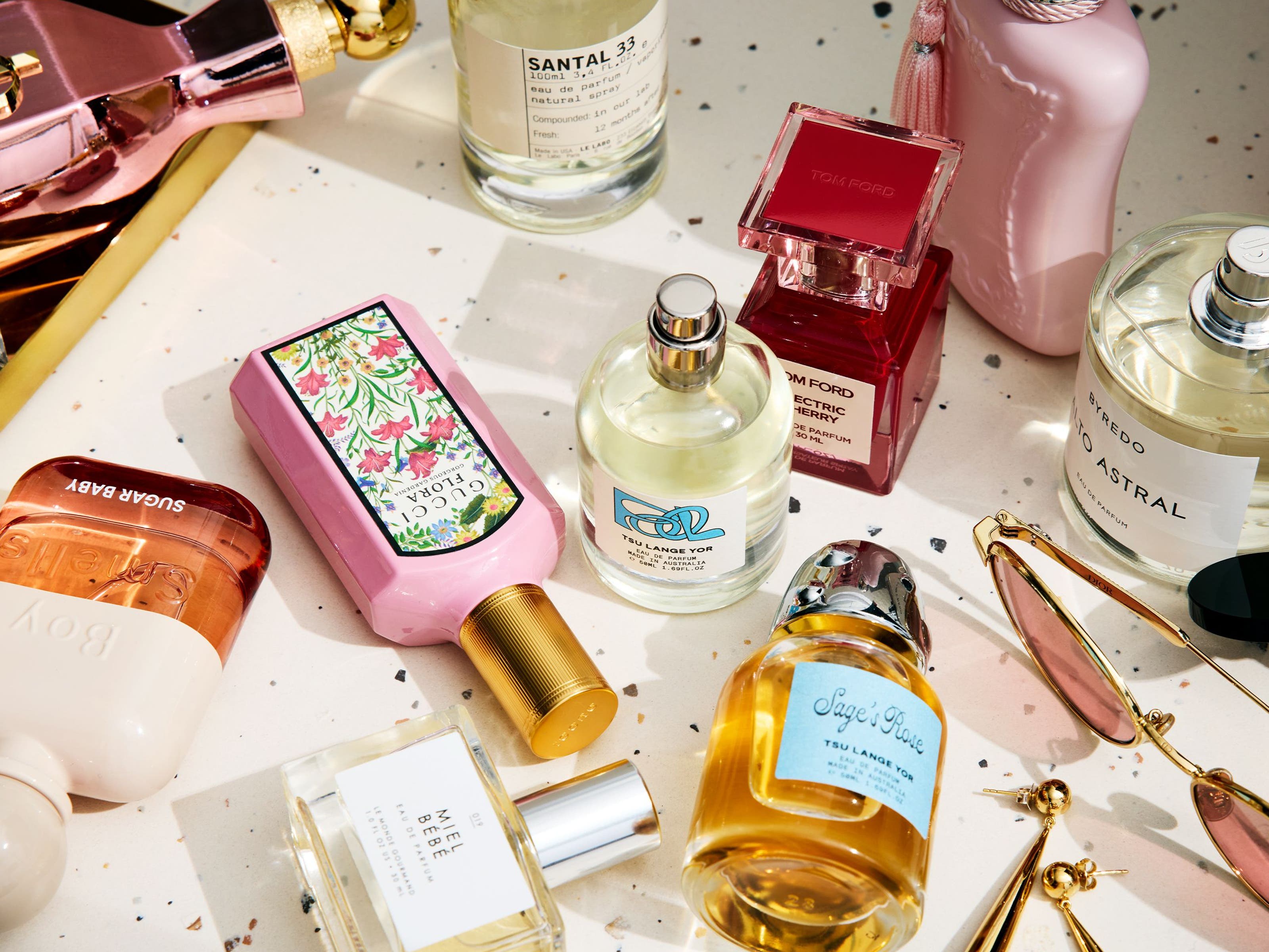 An assortment of perfume bottles on a countertop.