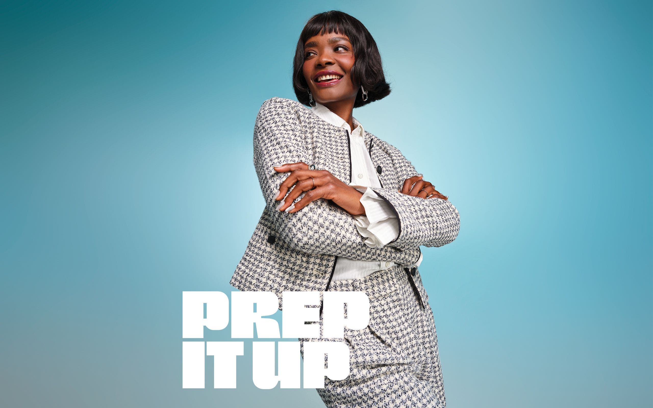 A woman wearing a white shirt and houndstooth suit.