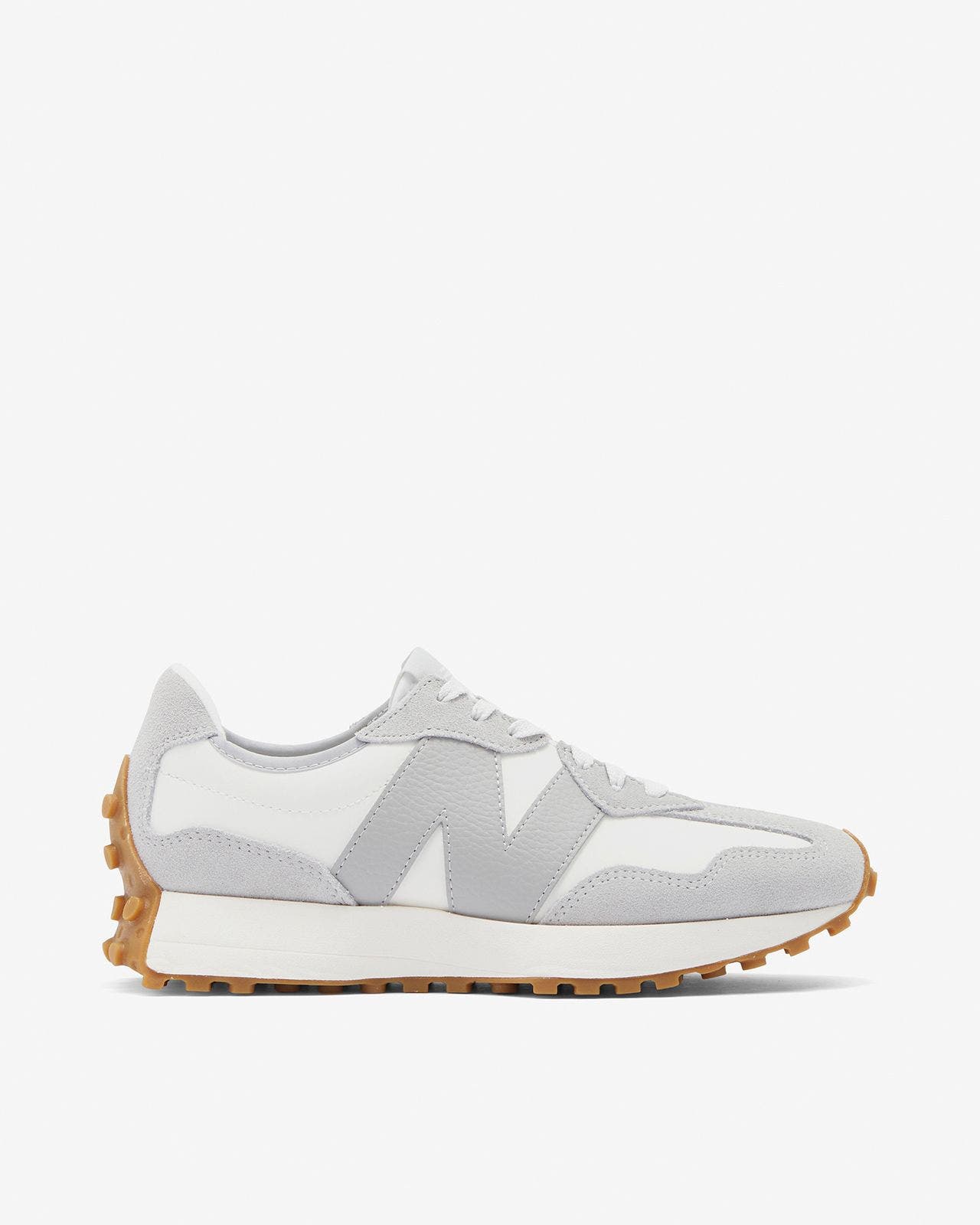 A women's New Balance sneaker in gray and white. 