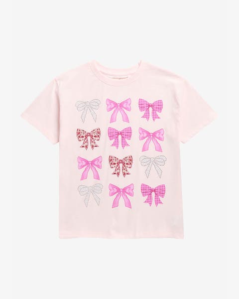 A girls' light pink T-shirt with pink bow prints.
