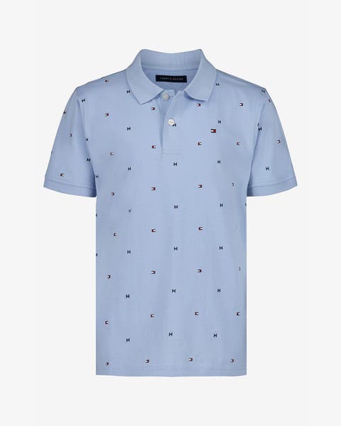 A boys' light blue short-sleeve polo with small allover embroidery.