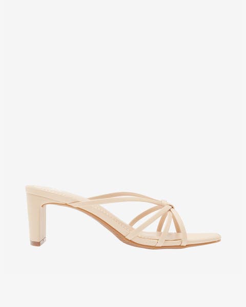 Beige mid‑heel strappy slide sandal.