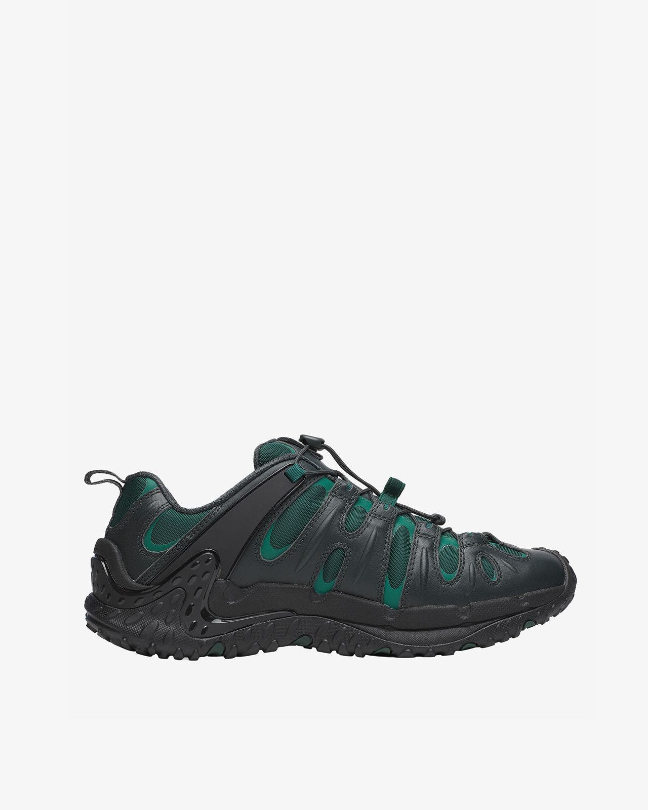 A men's black and green trail running shoe.