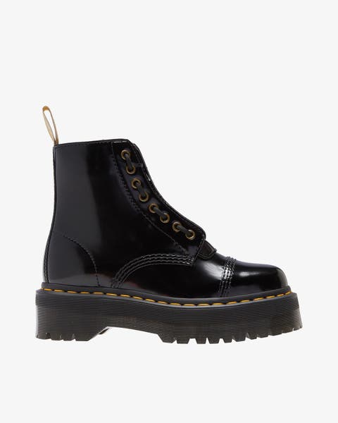 A black platform combat boot.