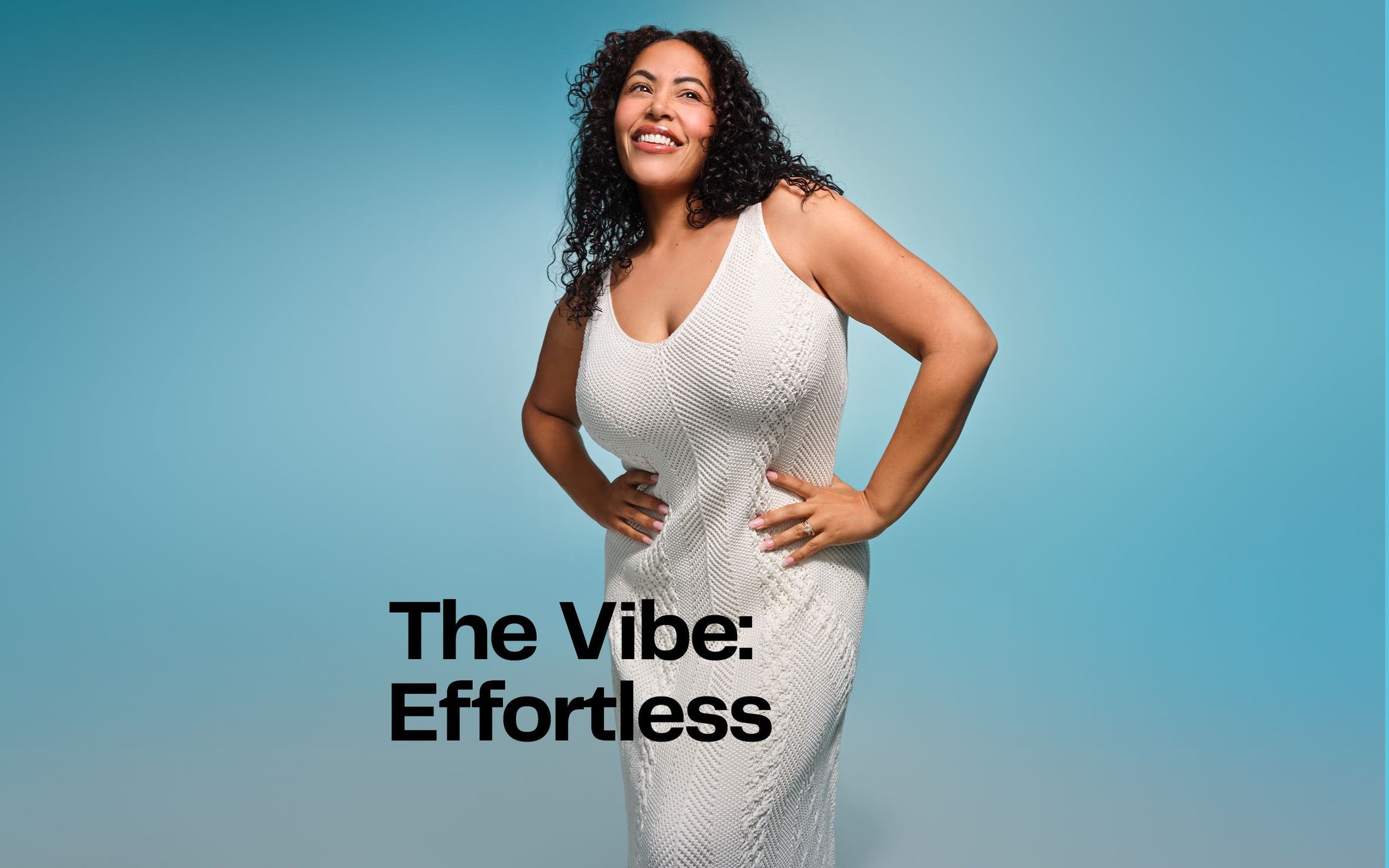 A woman wearing a white textured cable-knit sleeveless midi summer dress with a scoop neckline against a light blue background.
