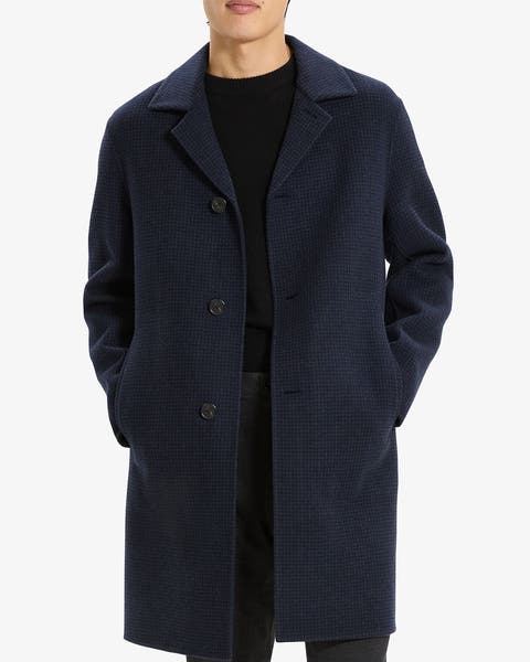 Men's navy blue wool topcoat with notched lapel and three-button closure.