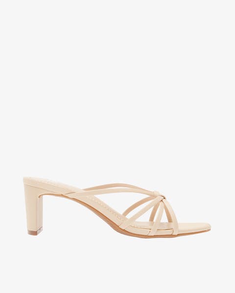 Cream-colored heeled sandal.