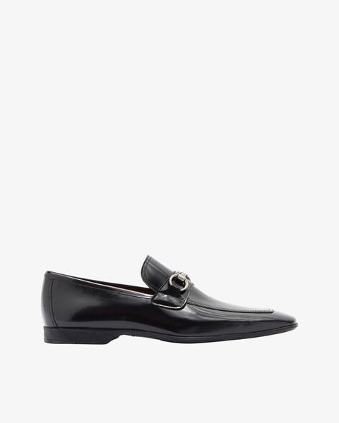 A black loafer.