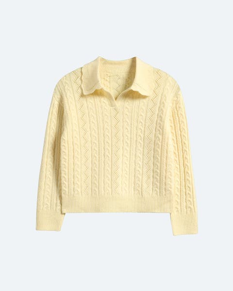 A yellow, polo-collar sweater in a cable pattern.