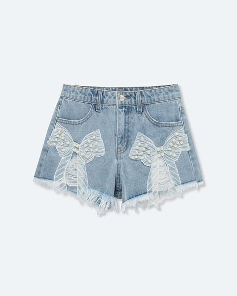 Denim cut-off shorts with pearl and bow details.